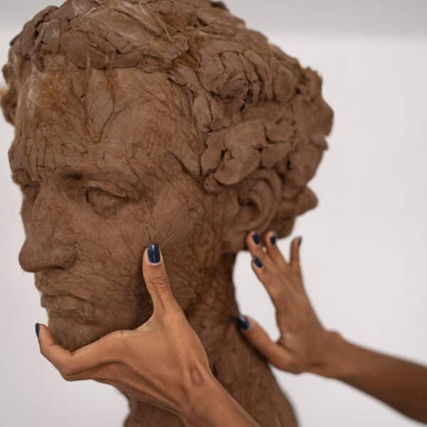 side-view-hands-clay-sculpting